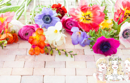 色とりどりの花と、笑顔で寄り添う女性たちのイラスト。